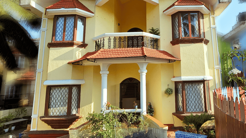 A bright exterior shot of the Amara Villa, Nagoa, featuring a beautiful entrance.