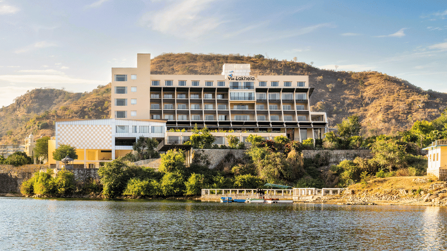 Facade of our luxury resort in Kumbhalgarh, featuring a hillside setting with a lake view.