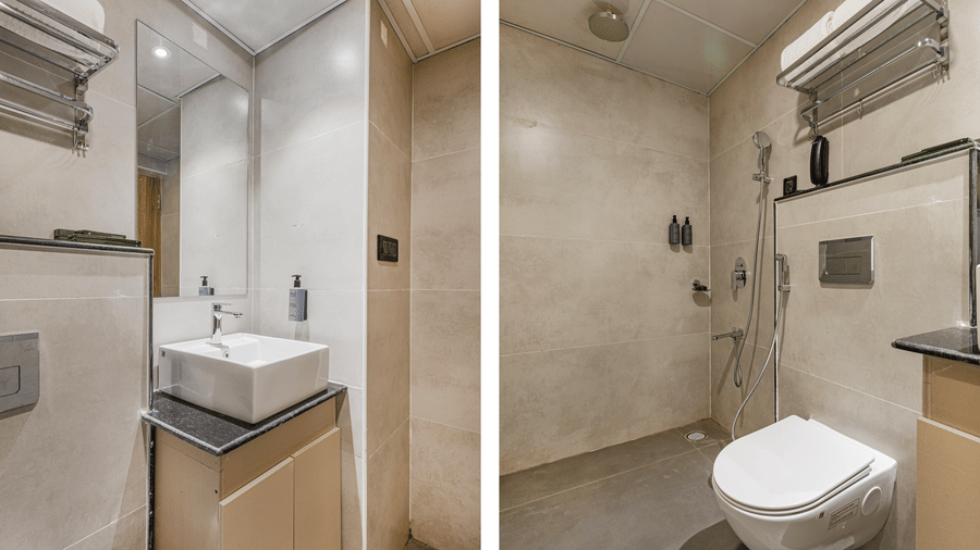 A bathroom at Lemonridge by Monday Hotels - KPHB showcasing a vessel sink vanity on left, and wall-mounted toilet on right.