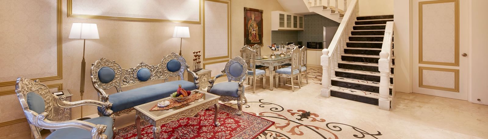 A living room featuring a bright chandelier and a mix of modern and traditional decor – Kaldan Samudra, one of the best 5 Star Resorts in Mahabalipuram