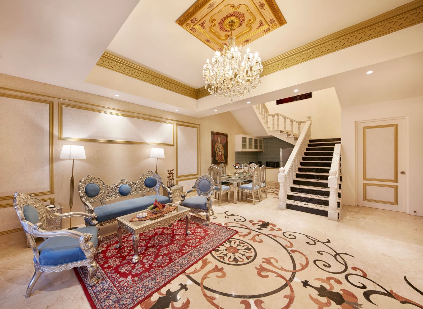 A living room featuring a bright chandelier and a mix of modern and traditional decor – Kaldan Samudra, one of the best 5 Star Resorts in Mahabalipuram