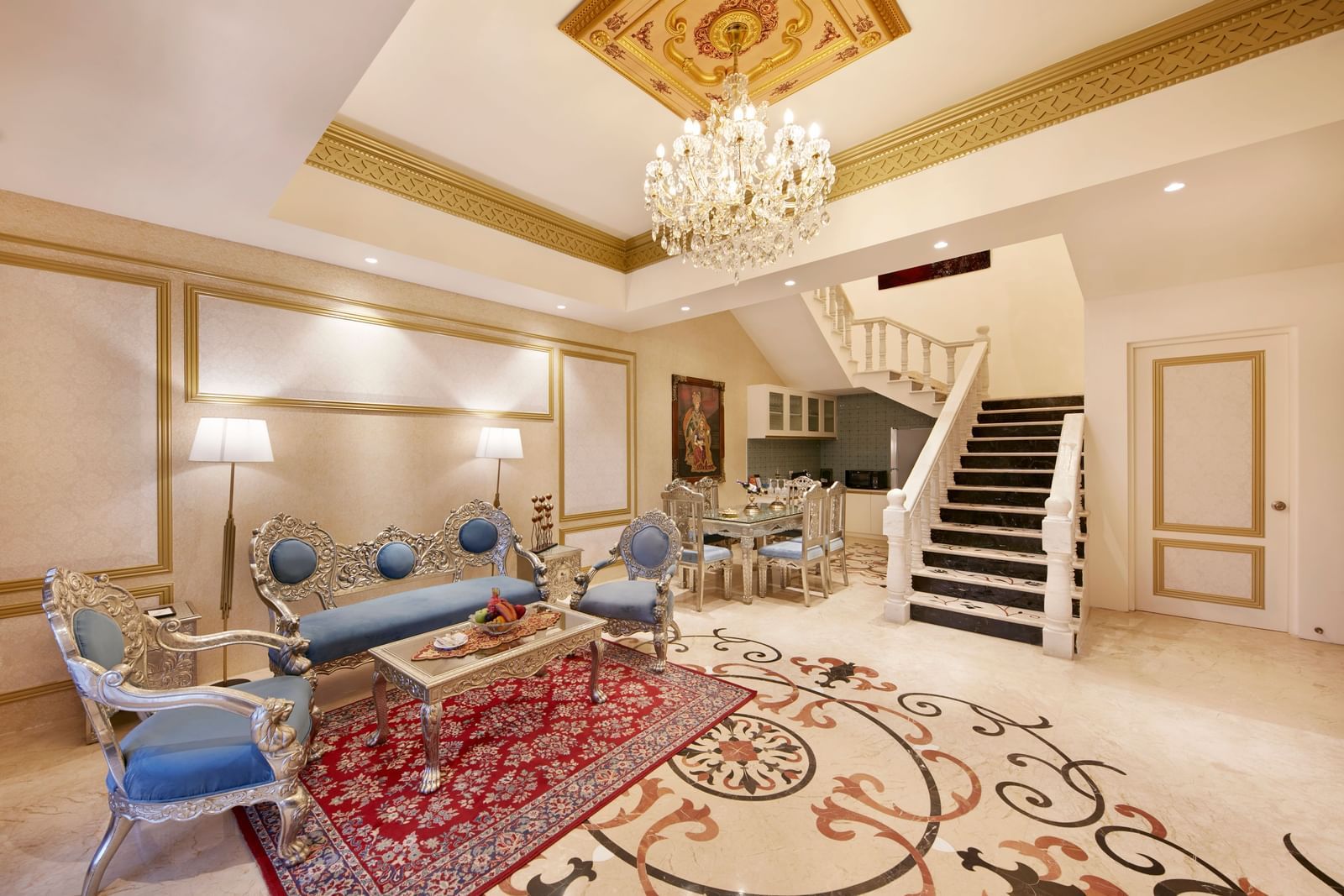 A living room featuring a bright chandelier and a mix of modern and traditional decor – Kaldan Samudra, one of the best 5 Star Resorts in Mahabalipuram