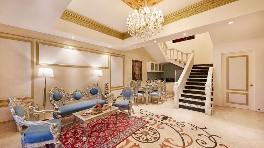 A living room featuring a bright chandelier and a mix of modern and traditional decor – Kaldan Samudra, one of the best 5 Star Resorts in Mahabalipuram
