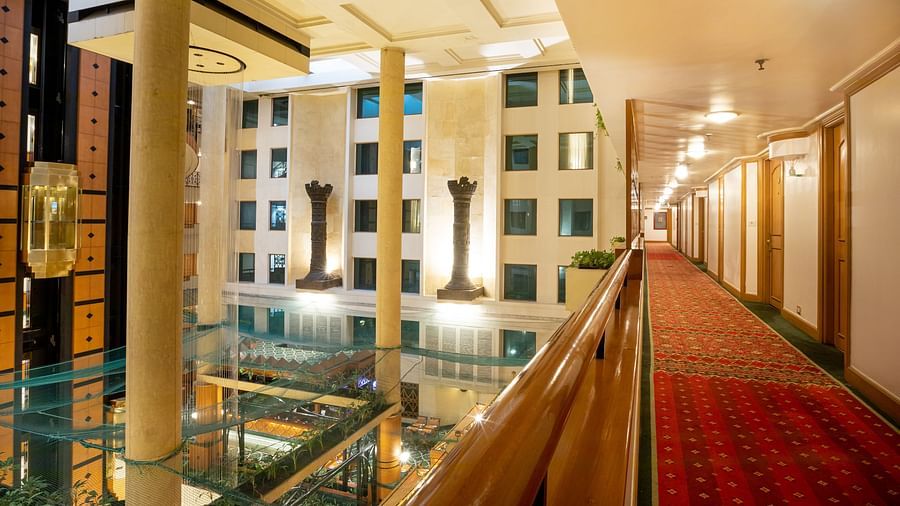 A corridor with a view of the nearby buildings - the orchid hotel near mumbai airport
