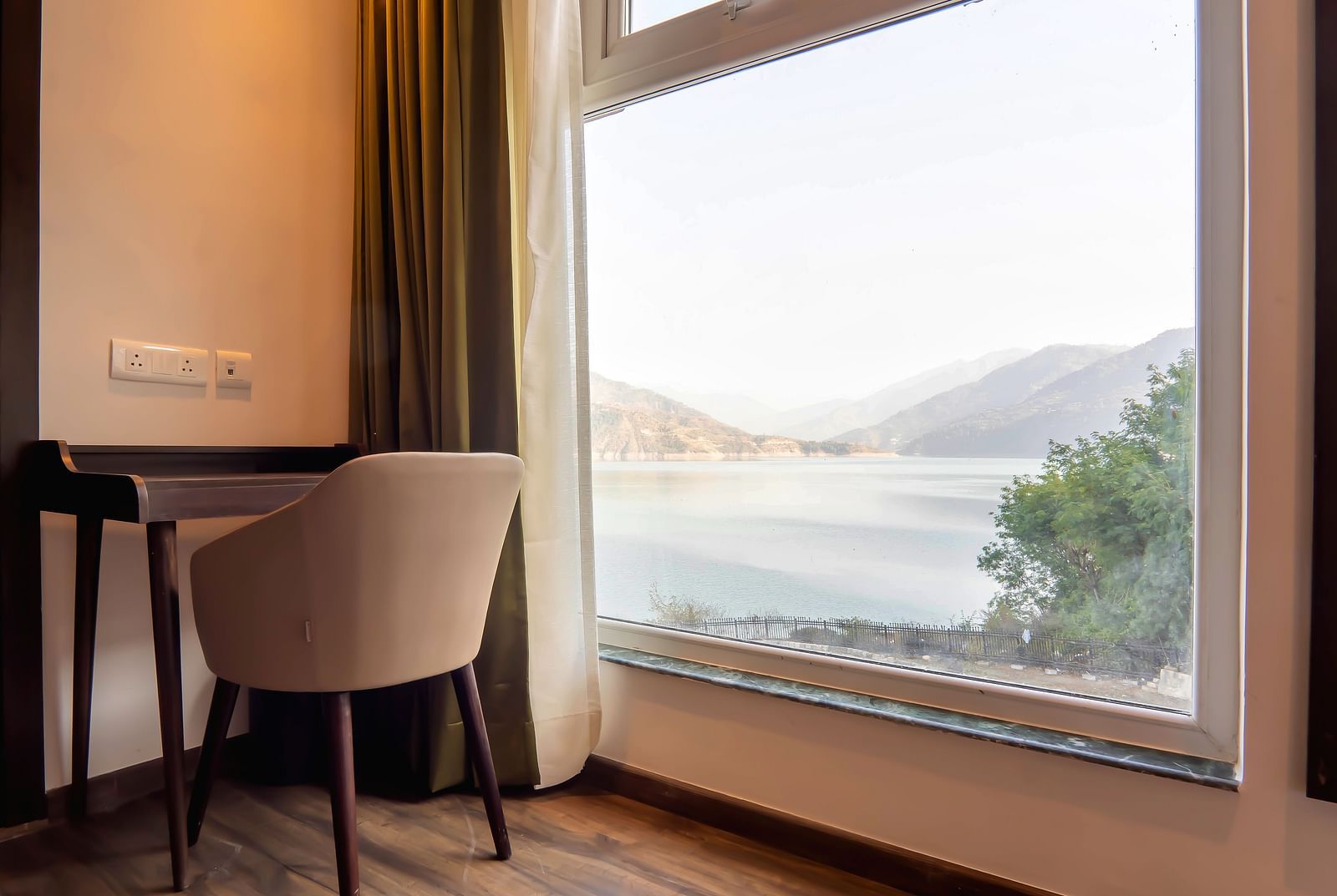 images showcasing the beautiful interiors of lake facing rooms - Hotel Le ROI Lake View Koti1