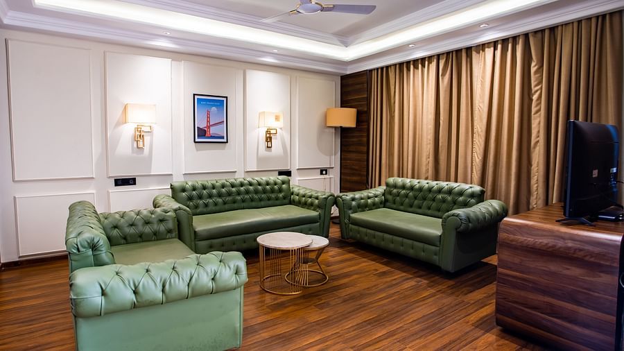 sofas with a table in the centre - Wedlock Greens Hotel Resorts Dhanbad