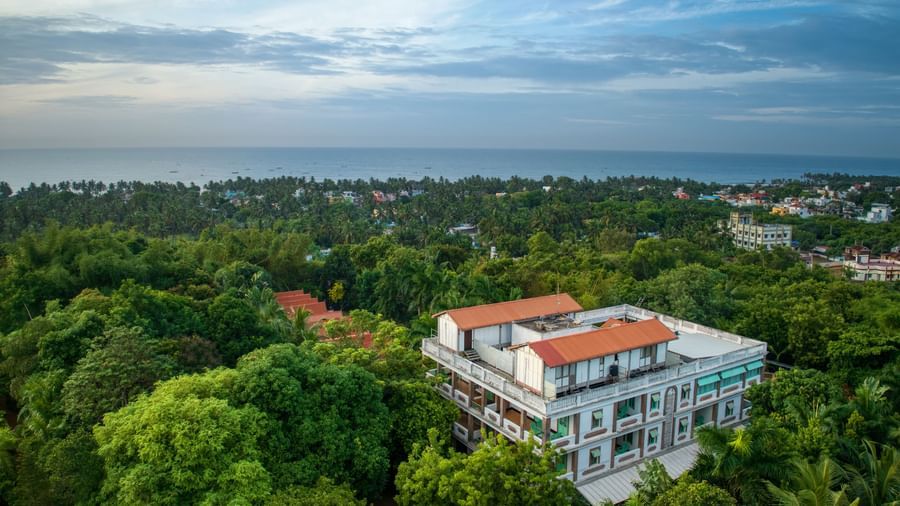 Side view of  the resort surrounded by trees.