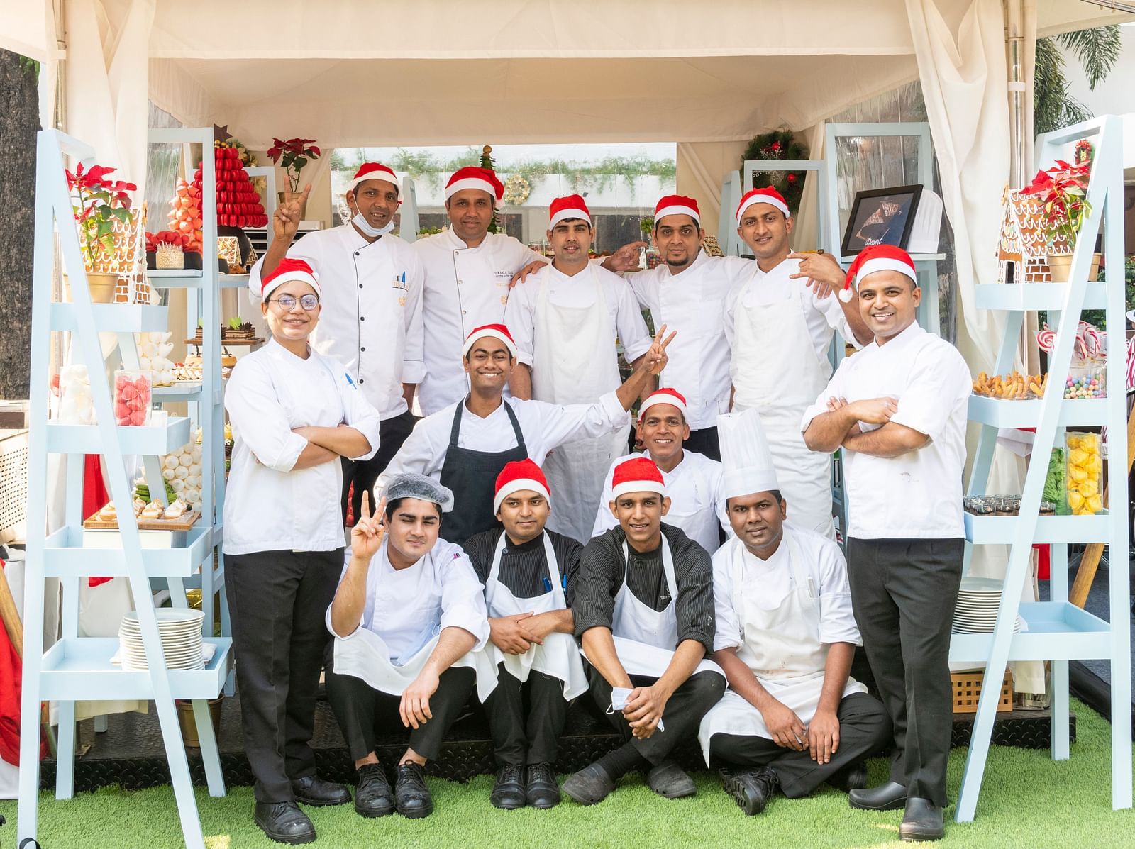 An image of a group of chefs wearing Santa hats - Claridges Collection