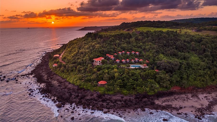 a sunset view of a hilltop resort with peaceful surroundings - Highland Sarovar Portico, Sindhudurg