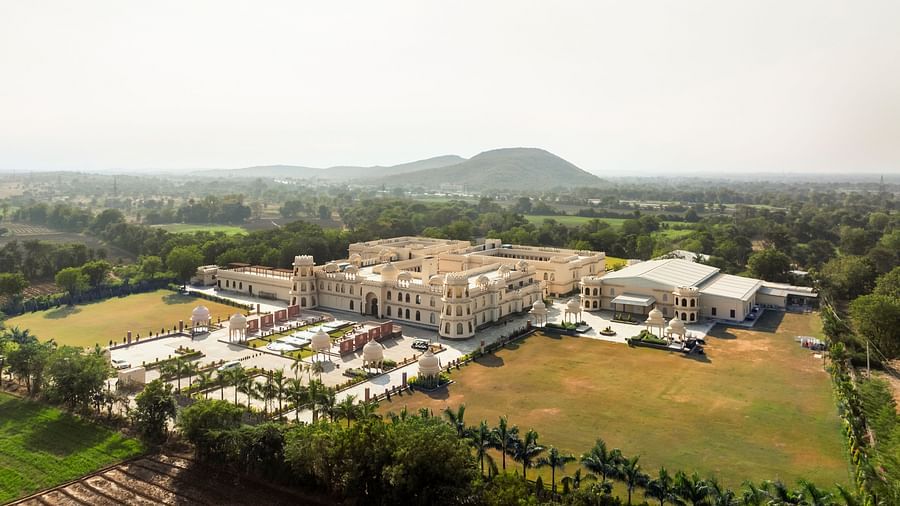 Aerial view of a Kesar Bagh Palace surrounded by greenery.