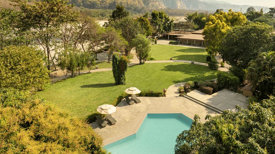 Aerial view of The Riverview Retreat Corbett showcasing lush greenery riverfront landscape and resort surroundings