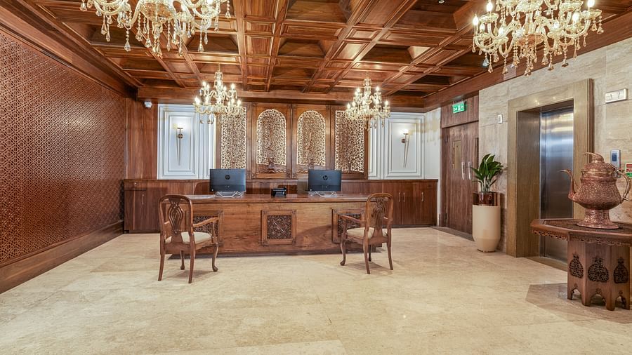 A Grand lobby with intricate chandeliers and wooden accents - Sarovar Premiere, Srinagar