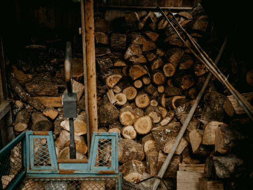 Large stacks of cut timber prepared for processing at a sawmill.