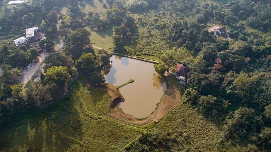 An aerial view of the lake next to the resort at Capitol Village Resort Madikeri