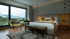 Premium room at Mountnoor Sarovar Premiere, Pahalgam with sophisticated interiors and breathtaking landscape views.