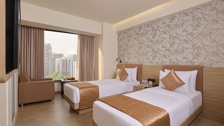 Comfortable hotel room with twin beds, perfect for sharing guests - Biznotel by Pride Motera, Ahmedabad