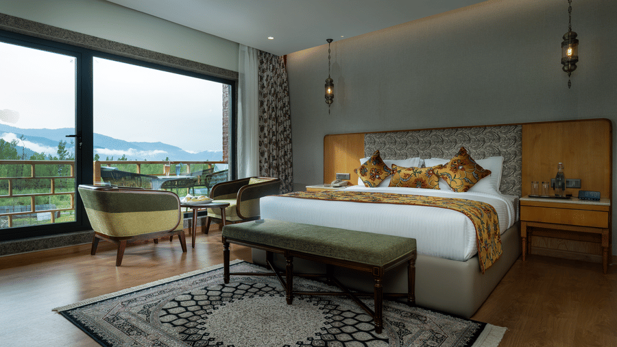 Premium room at Mountnoor Sarovar Premiere, Pahalgam with sophisticated interiors and breathtaking landscape views.