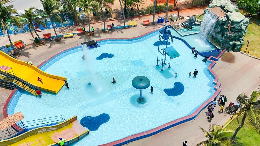 Chinnakutralam ride at MGM Dizzee World featuring a water slide at great height which leads to a swimming pool.