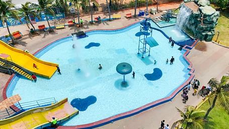 Chinnakutralam ride at MGM Dizzee World featuring a water slide at great height which leads to a swimming pool.