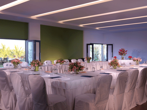 An overview of the Robusta Hall in Chikmagalur with U shaped seating arrangement - The Serai, Chikmagalur.