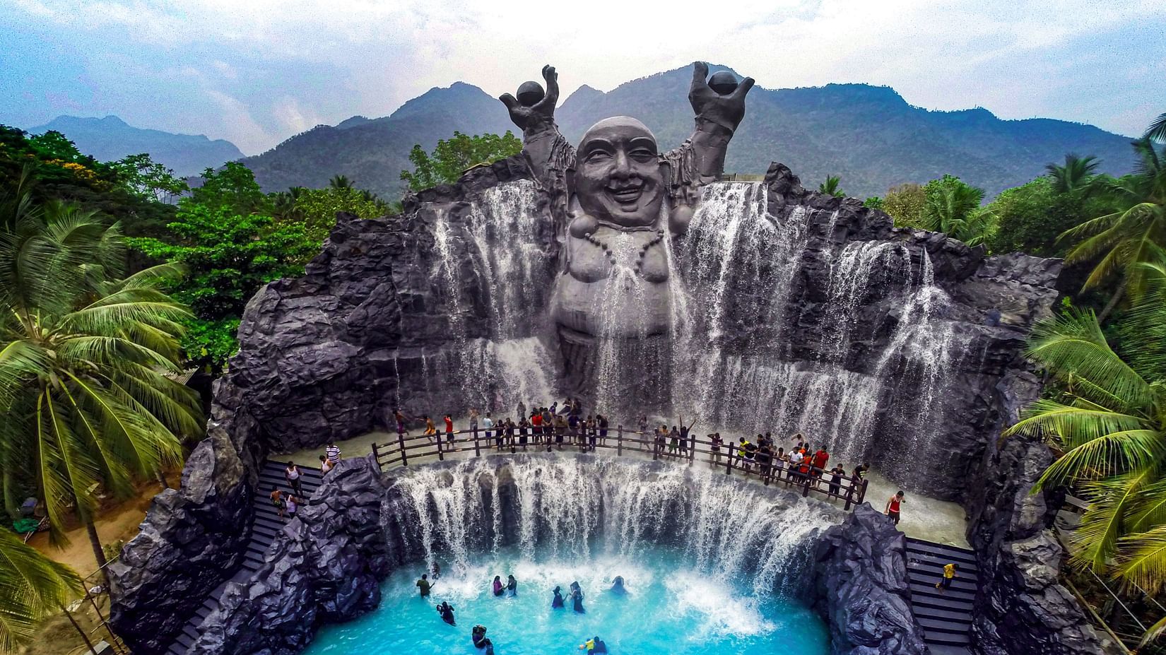 An aerial view of Lucky Ariel featuring a group of people enjoying the waterbody at  Black Thunder, Coimbatore.