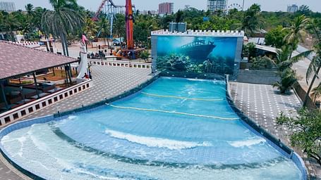 Thunder wave pool at MGM Dizzee World featuring a swimming pool which throws waves at people enjoying there.