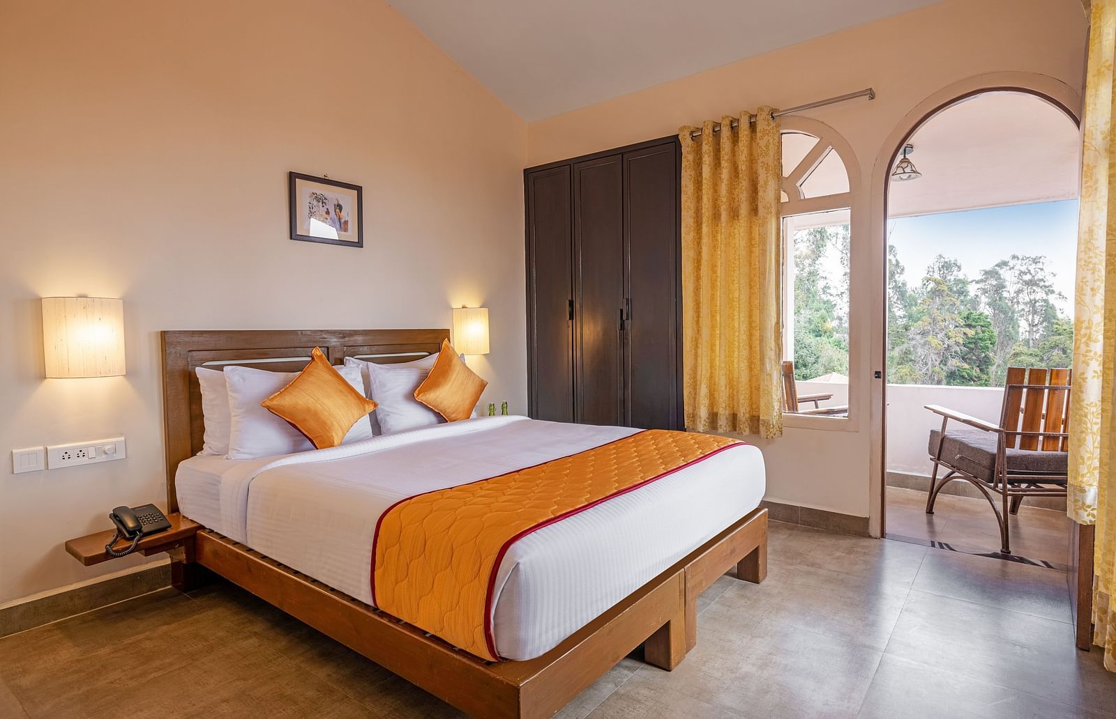An image of large bedroom with doubled-sized bed and a balcony attached | Mango Hill, Kodaikanal