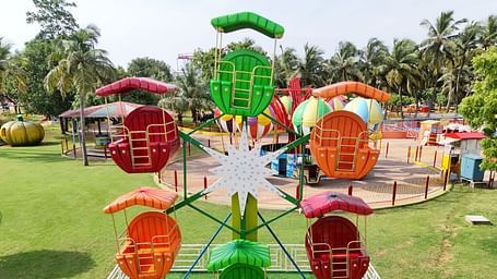 Ferrari's Wheel at MGM Dizzee World featuring mini rides with seats for kids which rotates and takes the rides up and down.