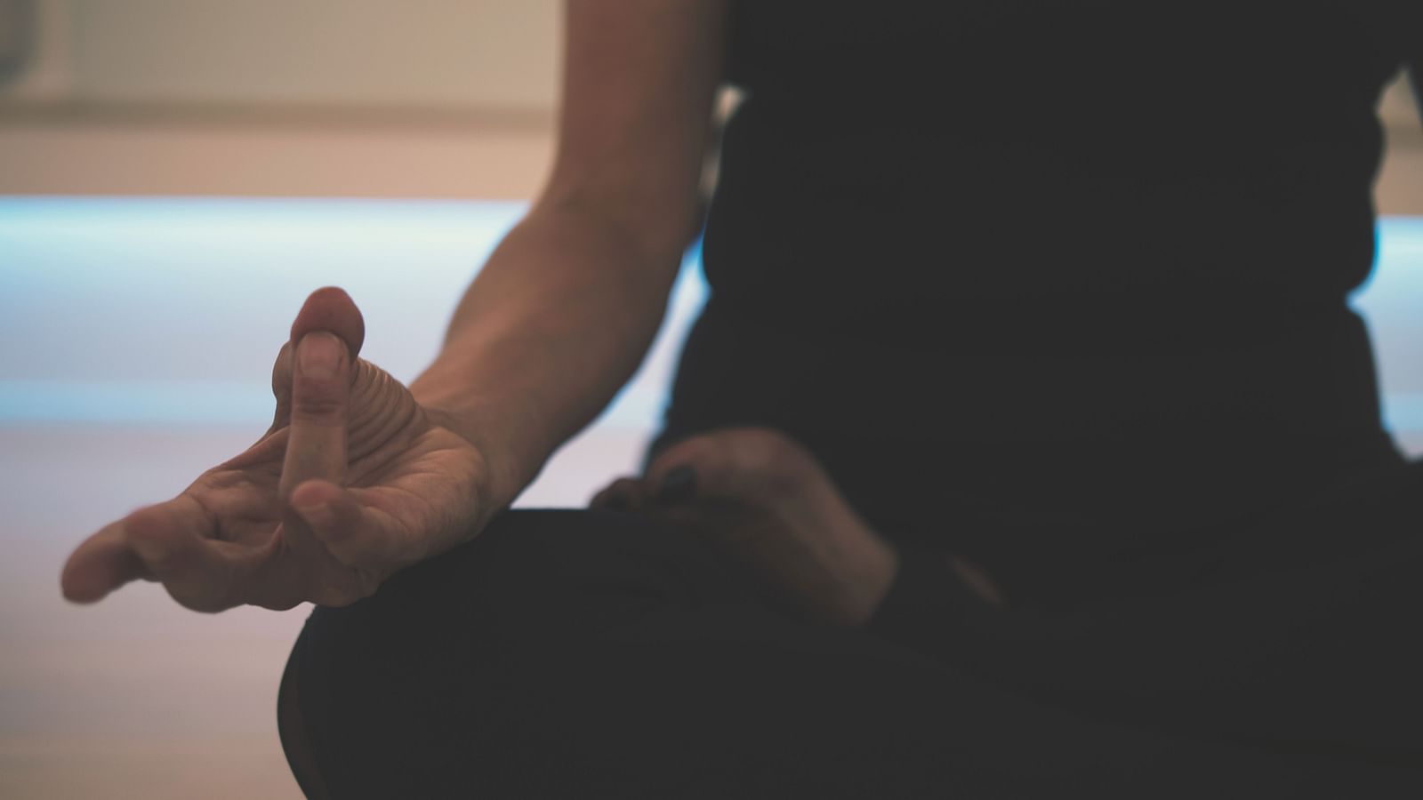 a close up shot of a person doing yoga on the floor