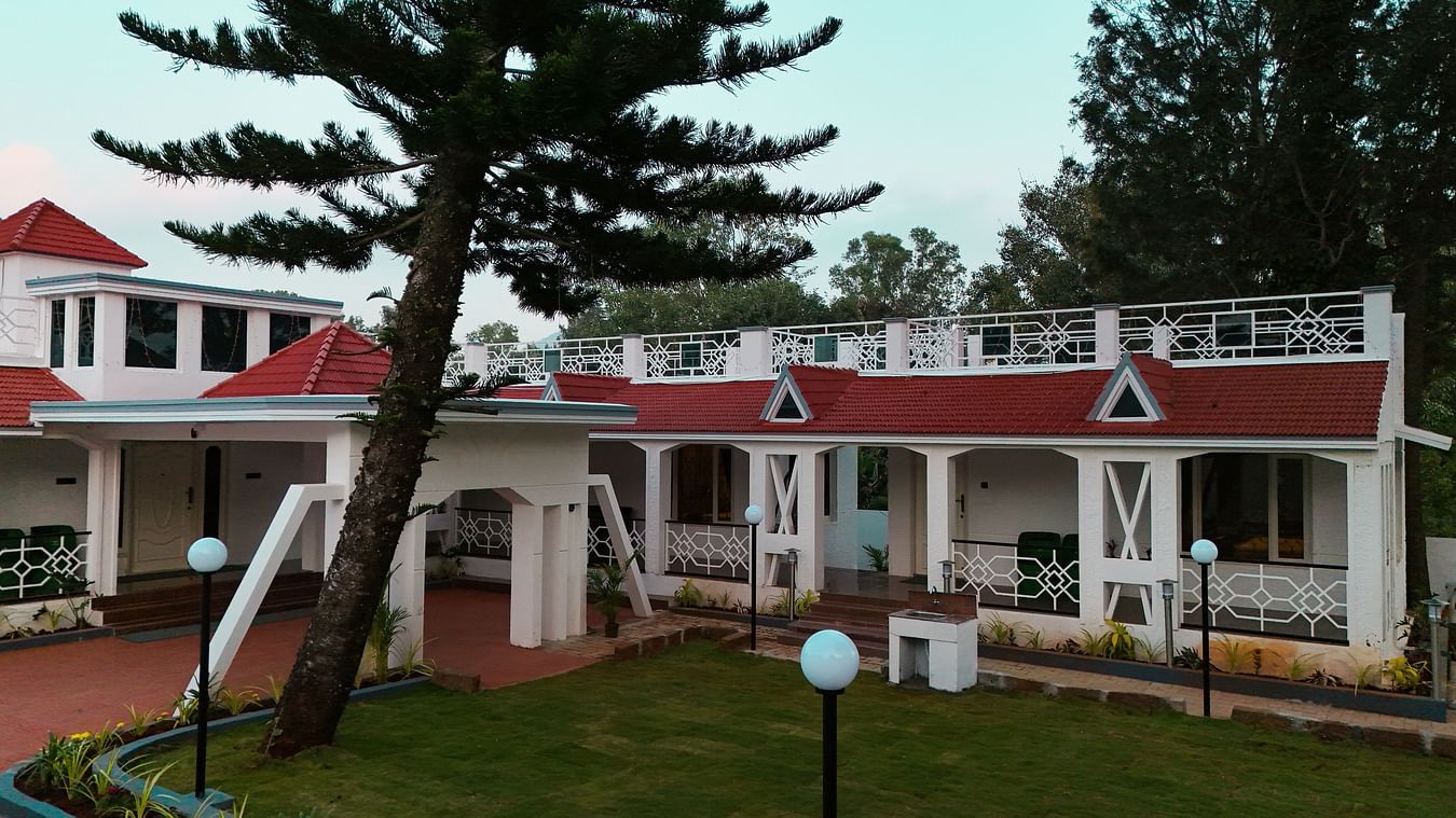 Aerial view of MGM Whispering Nest, Yelagiri surrounded by lush green trees around.