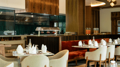 Elegant restaurant interior at Mountnoor Sarovar Premiere, Pahalgam with modern décor and refined dining ambience.