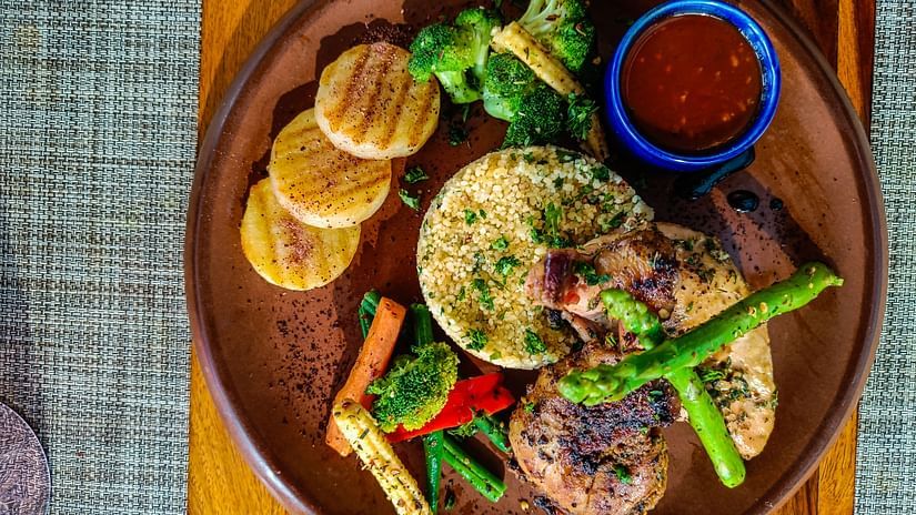 quinoa, sauce, grilled vegetables and chicken as seen from above - Karma Lakelands.
