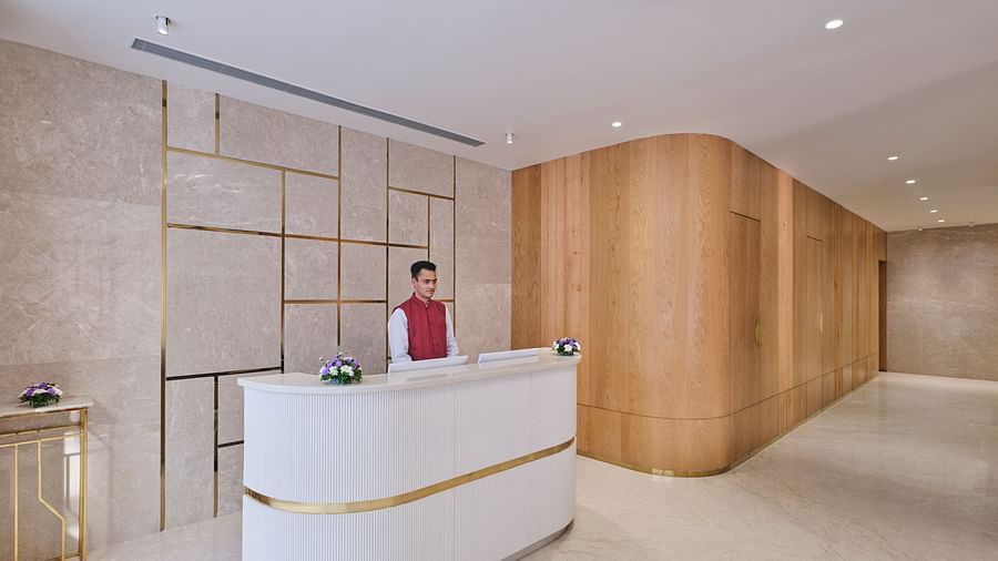 Hotel reception area with staff, ready to assist guests with check-in - Biznotel by Pride Motera, Ahmedabad