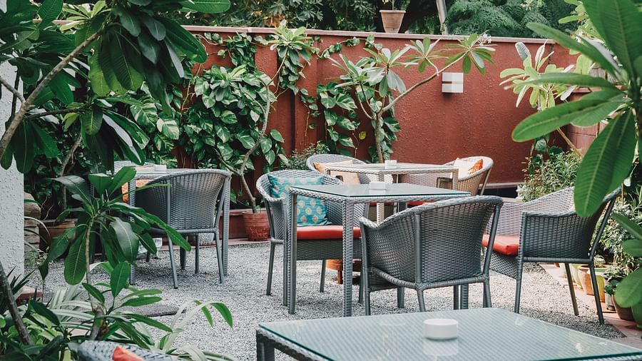 Outdoor dining arrangement at Ekaa Villa & Kitchen