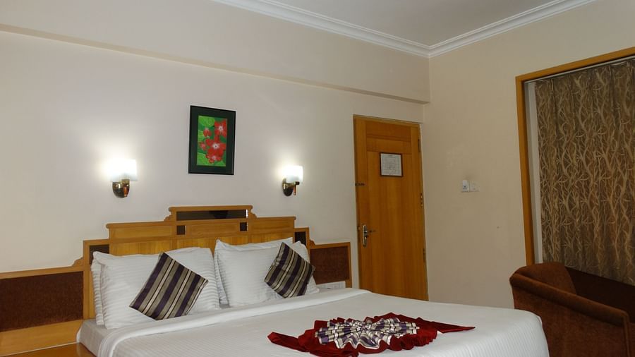 Spacious room with double bed and traditional decor at Kalyan Residency Hotel, Tirupati 