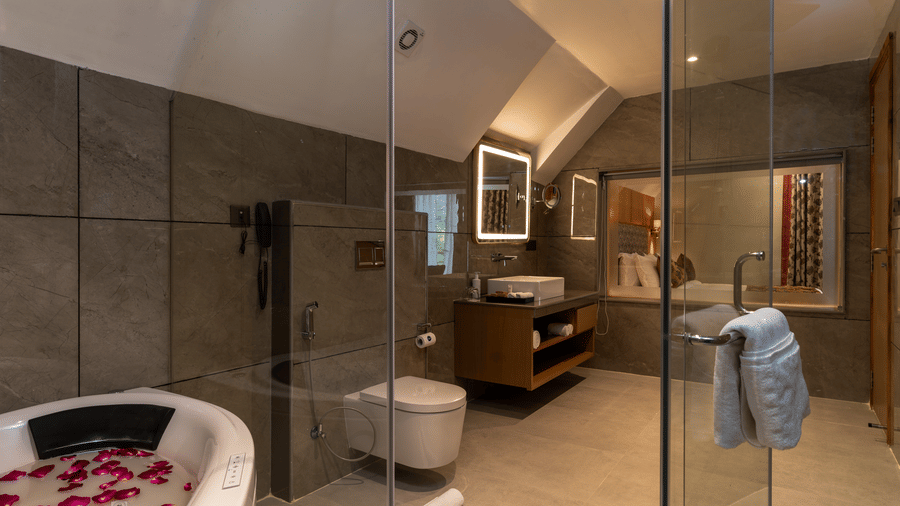 Spacious luxury bathroom at Mountnoor Sarovar Premiere, Pahalgam with contemporary fittings and refined décor.