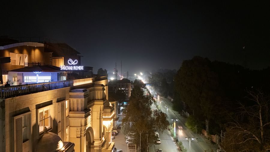An aerial image of our hotel with cars passing by the hotel - Sarovar Premiere, Srinagar