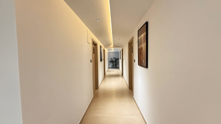 Hotel Kyzen hallway with guest doors – Shamshabad Airport, Hyderabad