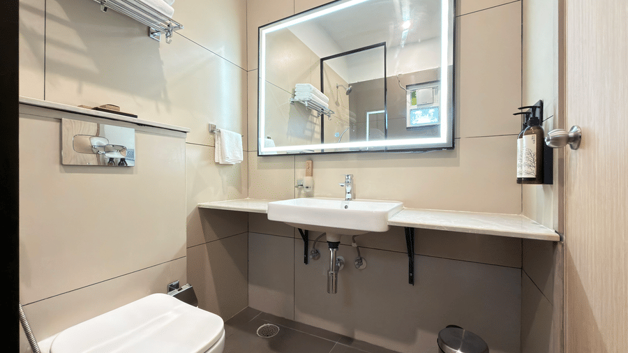 Premium Suite King Beds bathroom sink – Hotel Kyzen, Shamshabad Airport, Hyderabad