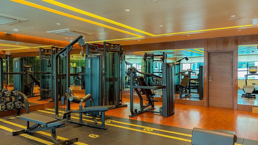 Fitness Center at KertelSuites, featuring modern gym equipment and stylish flooring designed