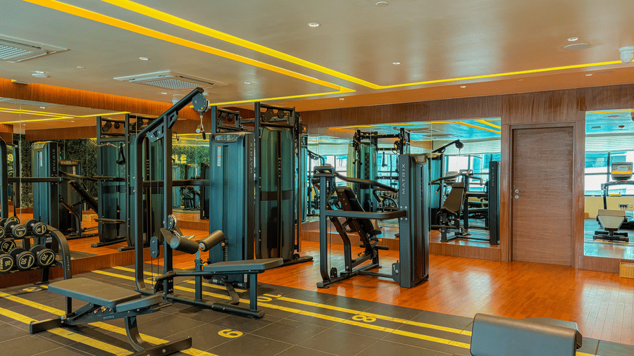 Fitness Center at KertelSuites, featuring modern gym equipment and stylish flooring designed.