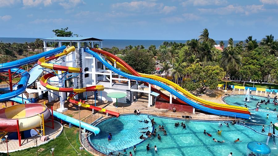 Side view of swimming pool with slides