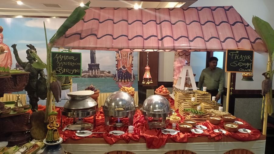 Intricately designed table with roof and food at SRM Hotel Tiruchirappalli- Hotel 
