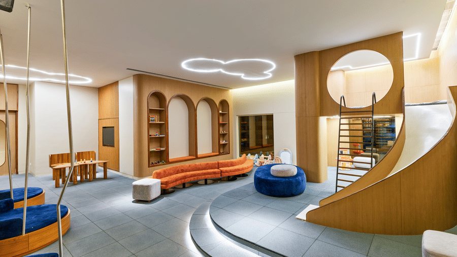 Play -Kids room at Swosti Premium Beach Resorts, Puri, with soft seating and a small slide.