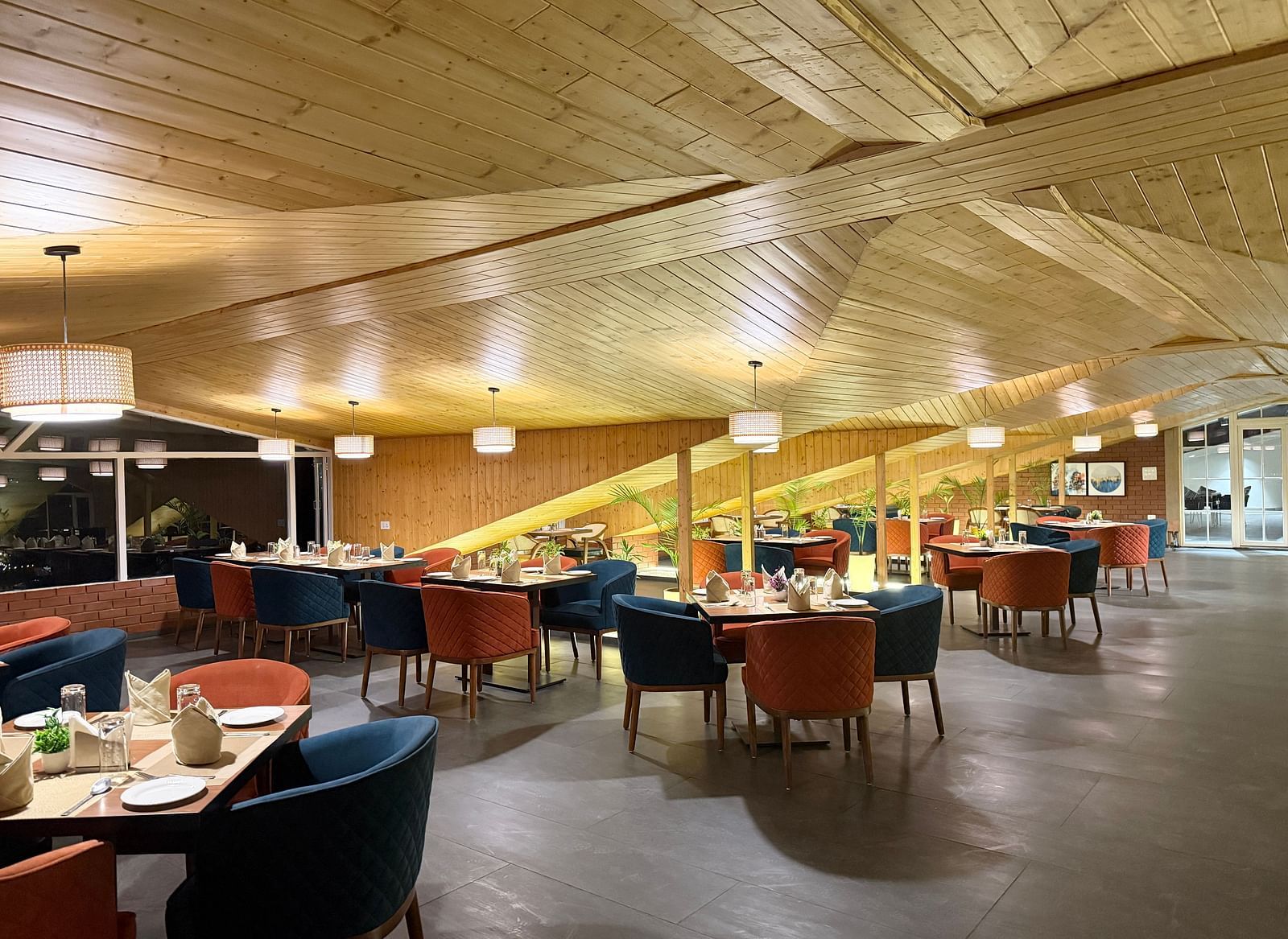 Elegant dining area with modern seating and warm lighting at Arnisa Boutique Hotel