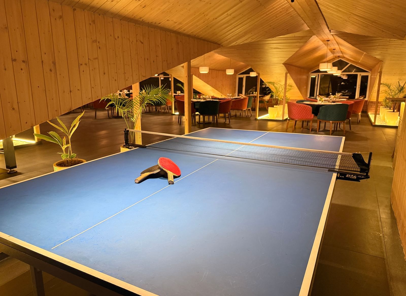 Indoor pool table area with ambient lighting at Arnisa Boutique Hotel
