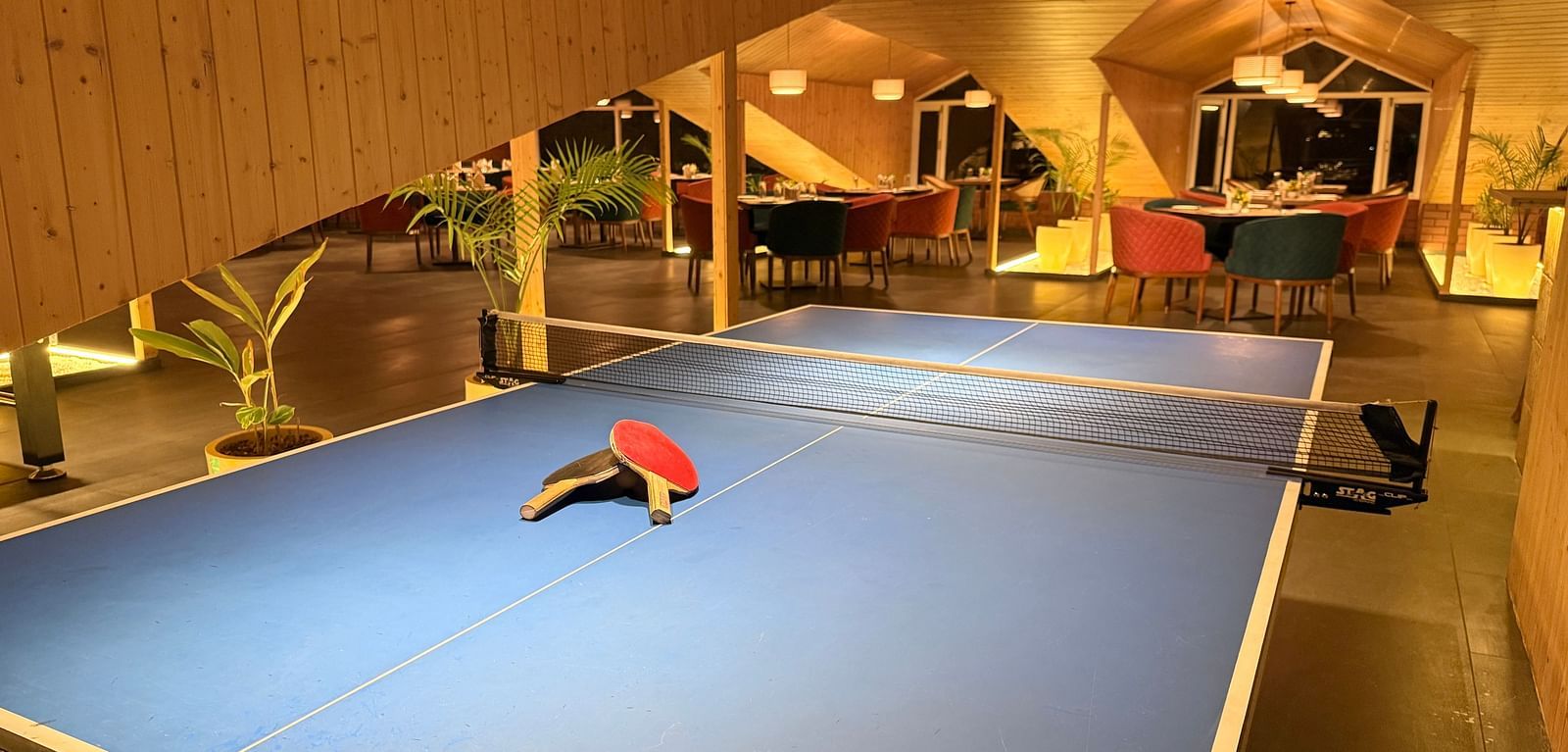 Indoor pool table area with ambient lighting at Arnisa Boutique Hotel