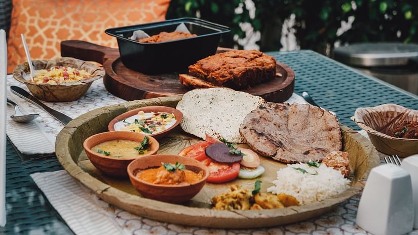 An Indian Thali being served in an outdoor setting at Ekaa