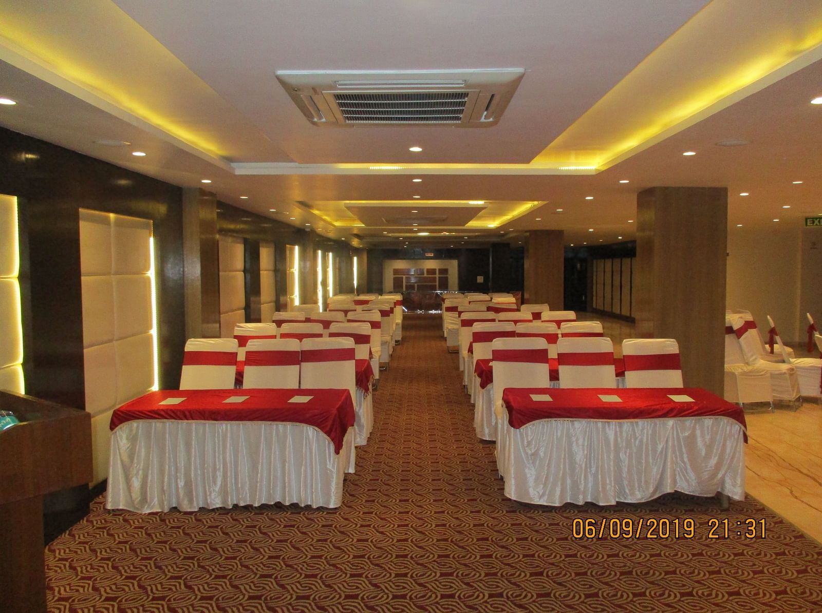 a spacious conference hall with theatre style seating at le roi raipur hotel