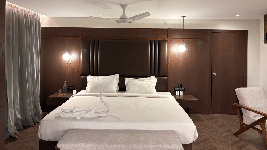 Perspective view of the suite's living and sleeping areas - Lords Riverside Resort, Muduba - Shivamogga